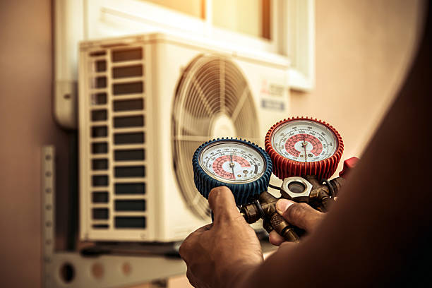 Professional Air Conditioning Service technician working in Edgewater, CO